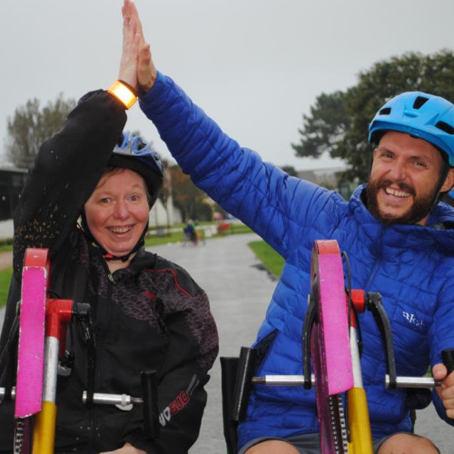 Riding adapted bike together thumbnail