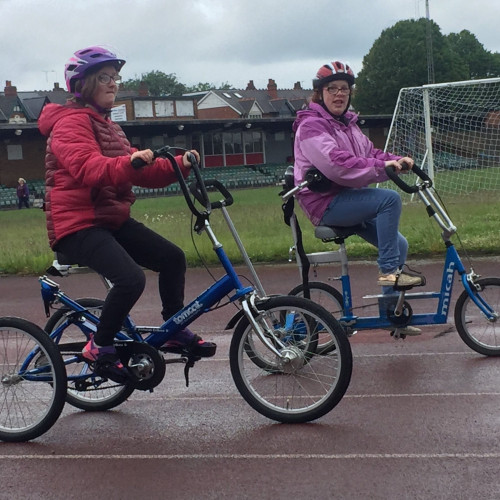 Riding adapted disabled bike on the track thumbnail