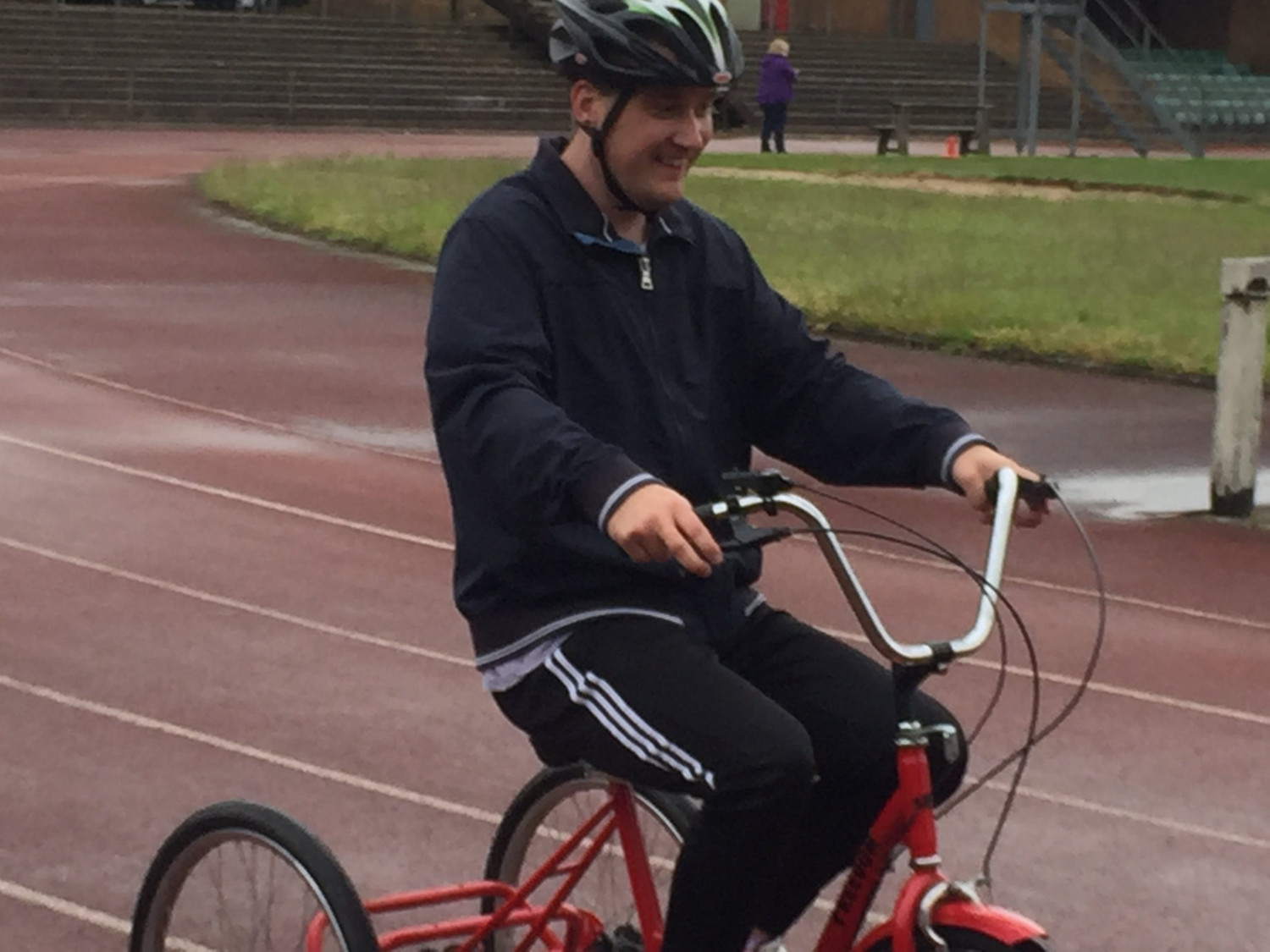 Riding adapted disabled bike on the track