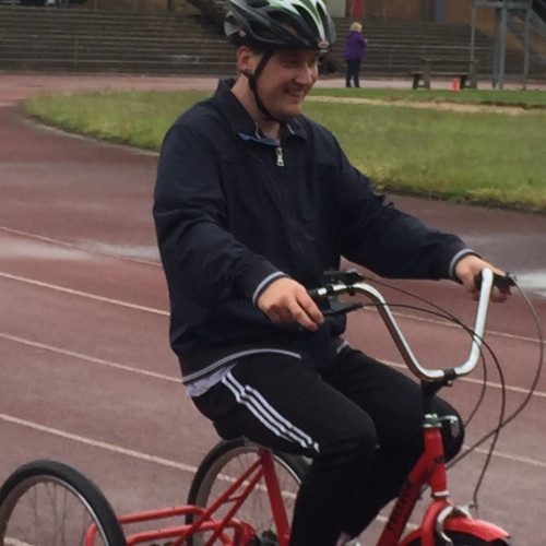 Riding adapted disabled bike on the track thumbnail