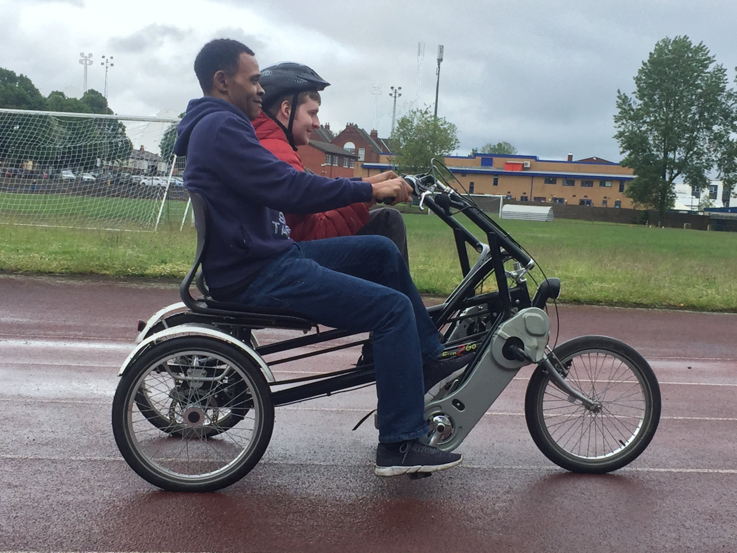 Riding adapted disabled bike on the track