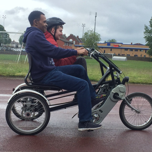 Riding adapted disabled bike on the track thumbnail