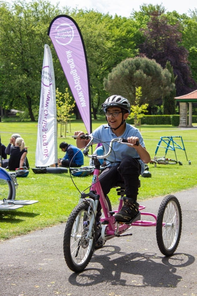 Boy riding bike in park
