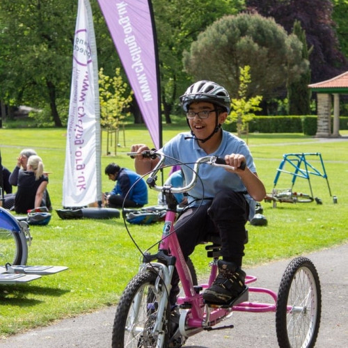 Boy riding bike in park thumbnail