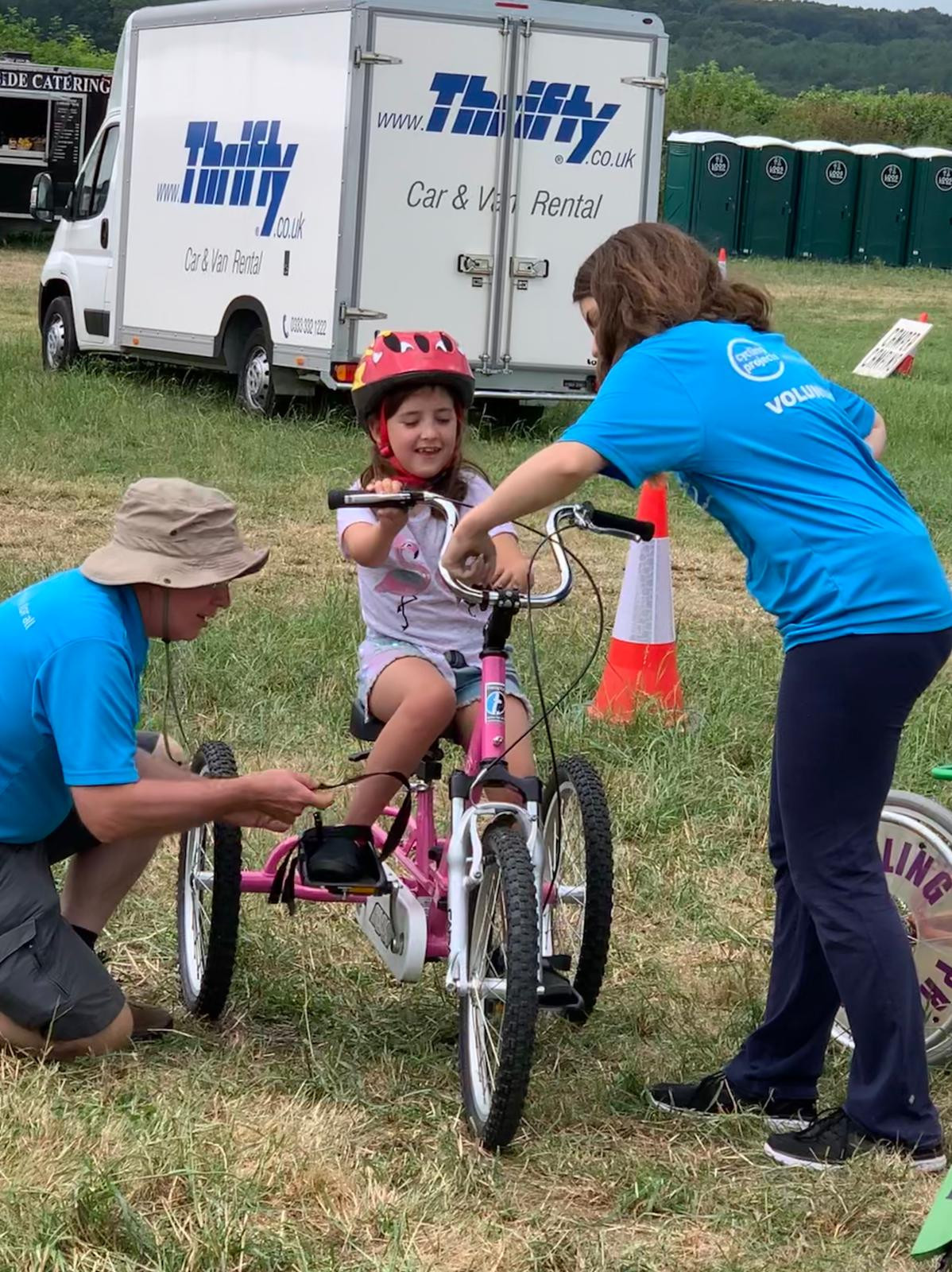 Child riding tricycle