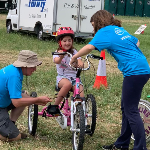 Child riding tricycle