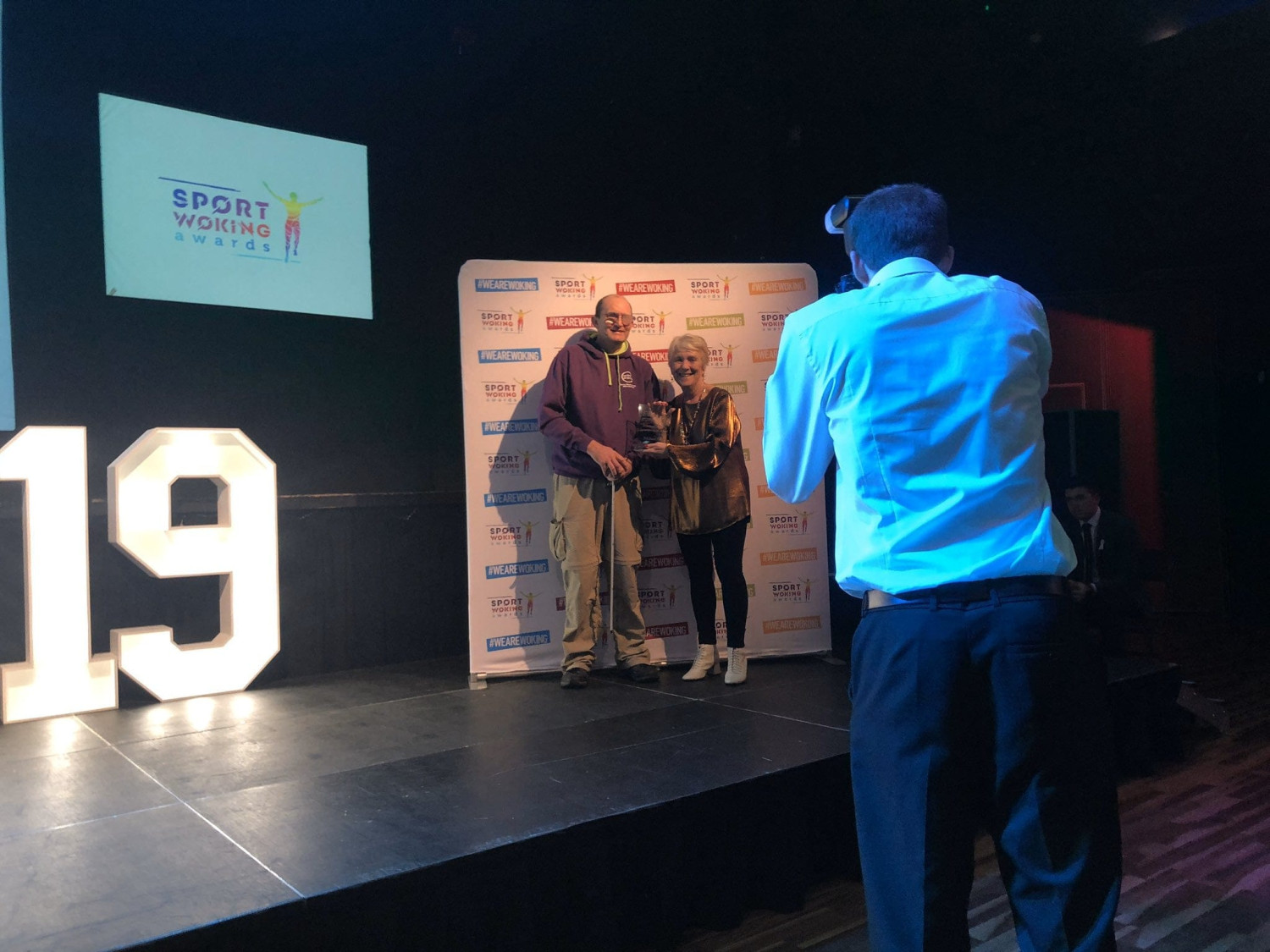 Michael receiving award